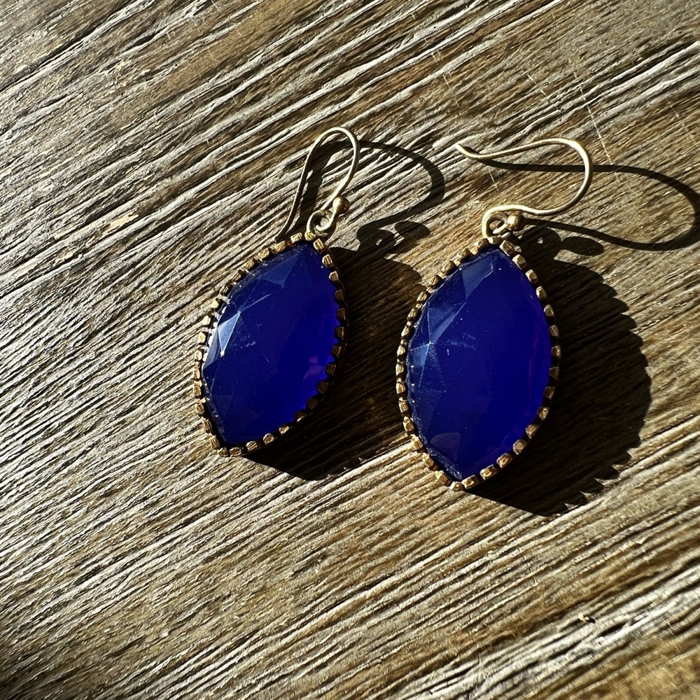 Beautiful polished lapis drop earrings with brushed bronze/gold setting.